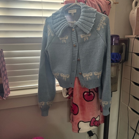 Sincerely Jules| Blue Cardigan Sweater with bows and gold button look. - Picture 2 of 5